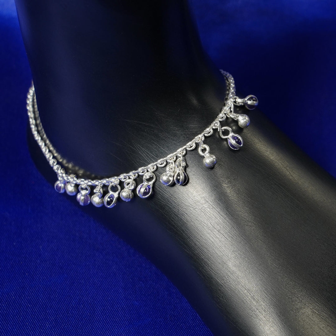 Fancy anklet with silver and purple charms